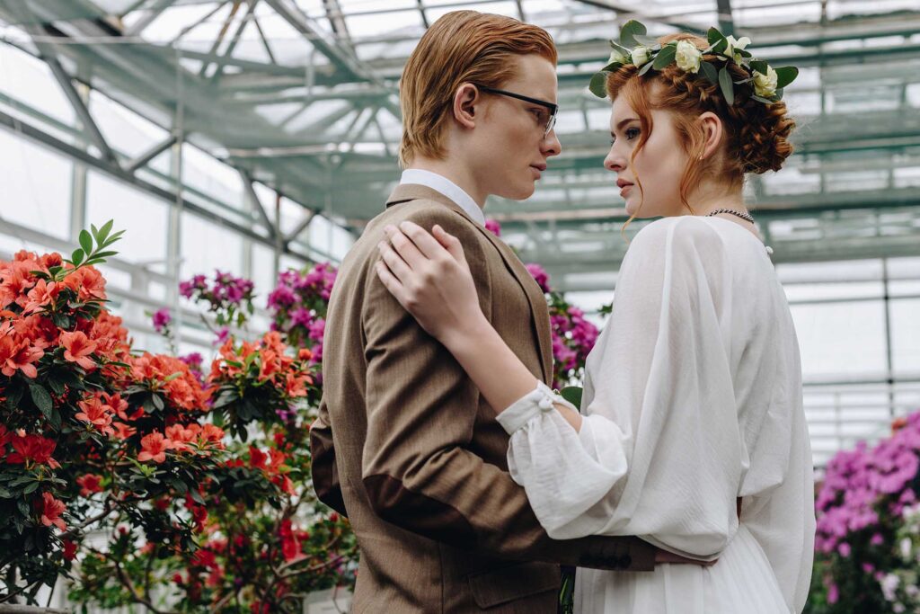 beautiful-young-red-haired-wedding-couple-embracin-RXR4R3H.jpg